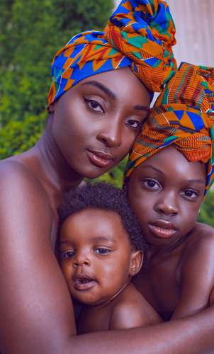 african boy 2 women lying on green grass field during daytime african girl